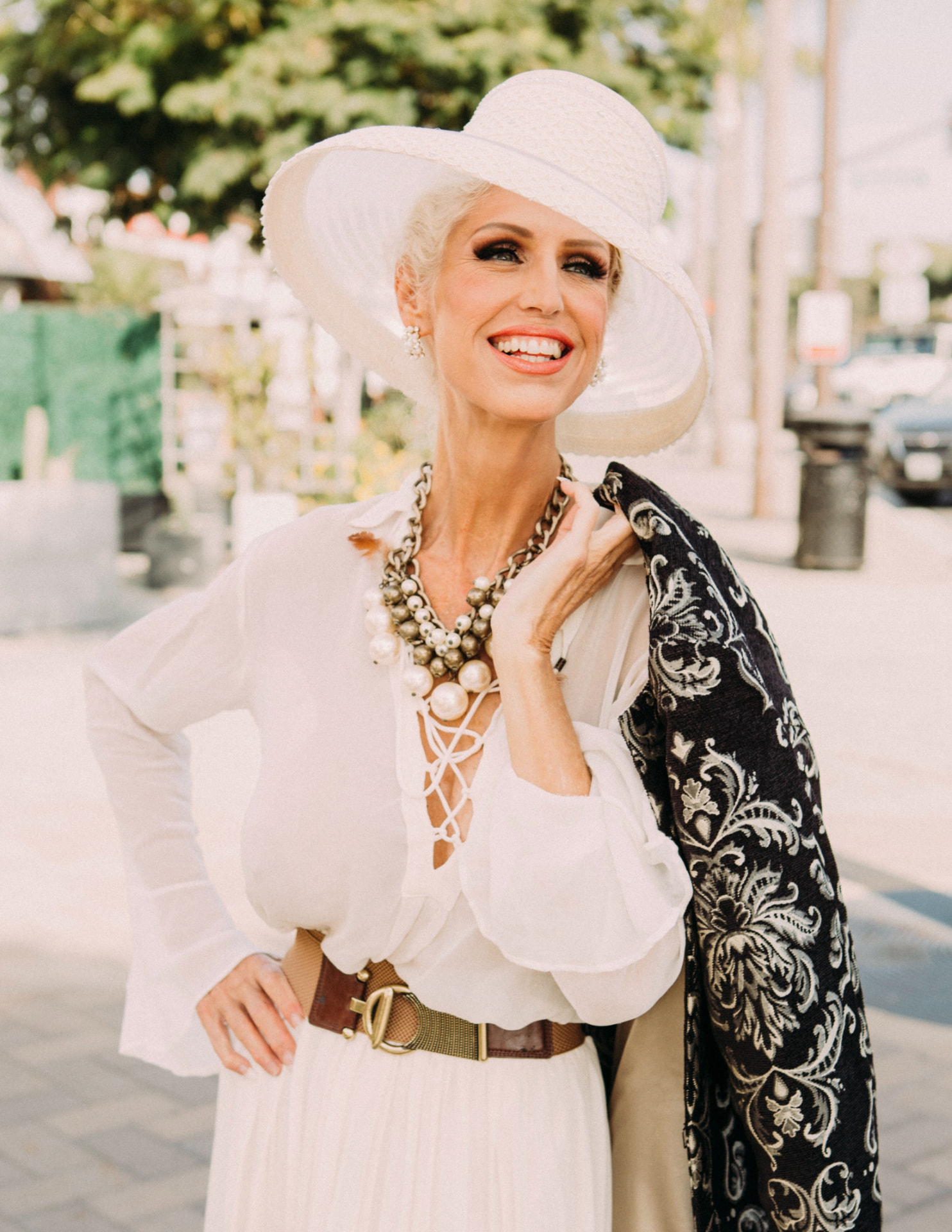 Misty Klein, Certified Hypnotherapist, outdoors in a wide brimmed hat